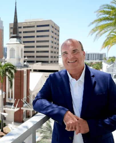Rev. Brett DeHart, Senior Pastor of First United Methodist Church of Sarasota, on a rooftop overlooking downtown Sarasota.