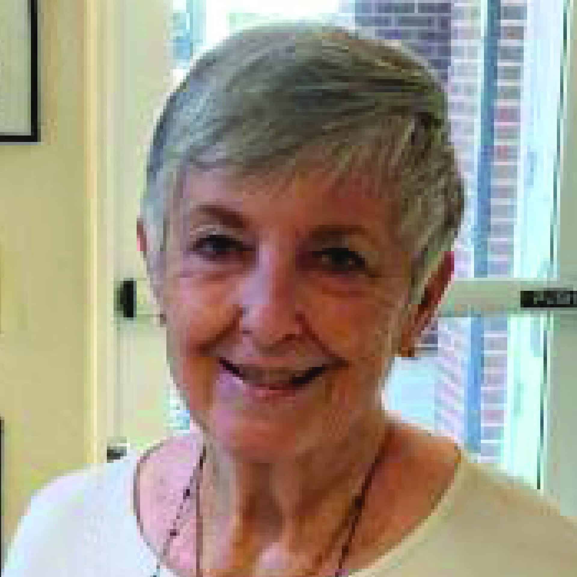 Staff member at First United Methodist Church of Sarasota smiling in a church office doorway