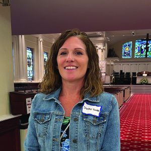 Shelby Smith, staff member at First United Methodist Church of Sarasota, standing in the Sanctuary.